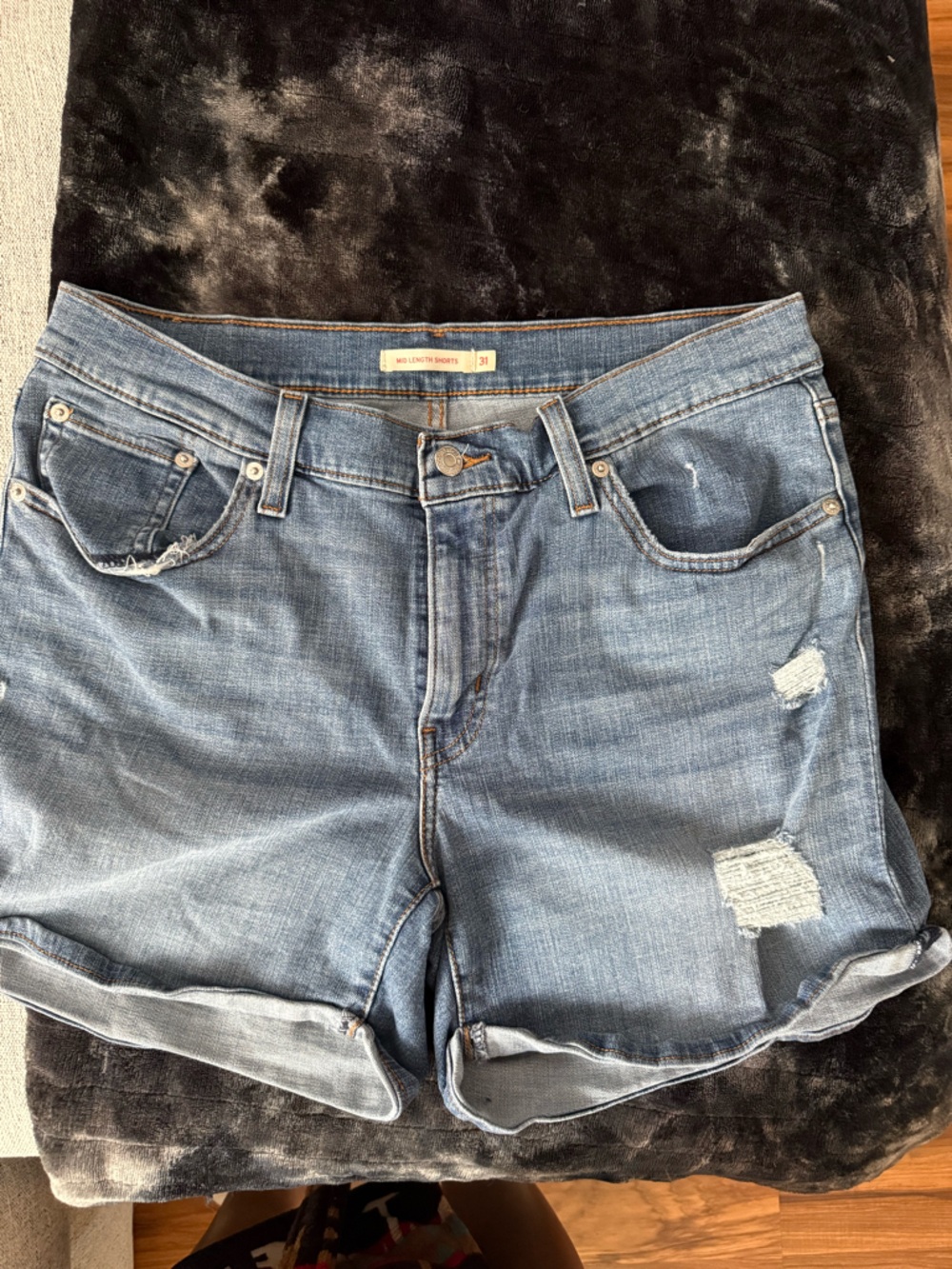 Levi’s mid length Distressed Light Blue Denim Shorts